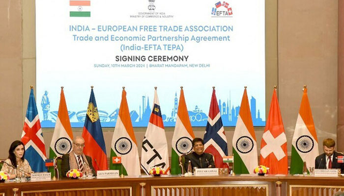 This handout photograph released by PIB on March 10, 2024 shows officials at the signing ceremony of TEPA between India and European Free Trade Association (EFTA) in New Delhi, India.  — AFP