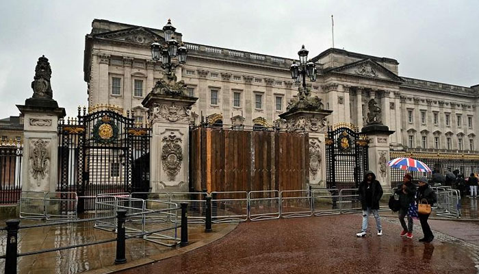 The gates of Buckingham Palace in London are seen boarded up on March 10, 2024. — AFP/File