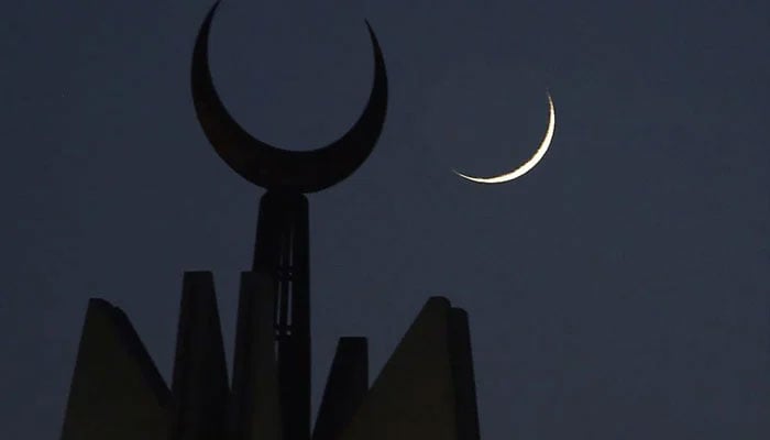 New crescent seen on th sky in the background of a mosques minaret in this image. — AFP/File