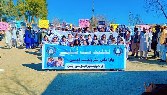 Students, tribal elders, political parties activists, local government representatives holds placards and banner during the “Mass Enrollment Campaign March,” rally on March 9, 2024. — Facebook/WAWA- Wana Welfare Association Official