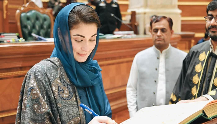 Punjab’s chief minister-elect Maryam Nawaz while signing a yellow book in the Punjab Assembly on February 23, 2024. — Facebook/Maryam Nawaz Sharif
