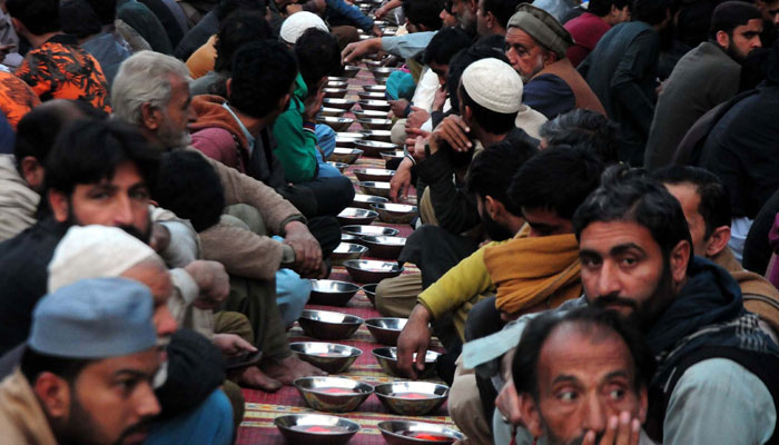 Faithful Muslims are breaking the fast (Iftar) during the Holy month of Ramadan, at Raja Bazar in Rawalpindi on March 12, 2024. — PPI
