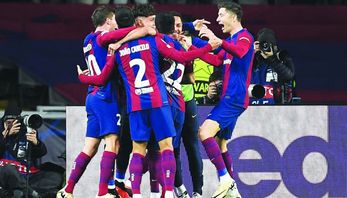 Barcelona players celebrate their goal. — AFP/File