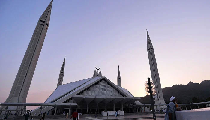 People can be seen at Faisal Mosque in Islamabad. ─ AFP/File