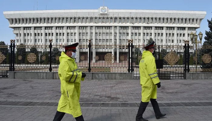 Police officers patrol in front of the parliament building in Bishkek, Kyrgyzstan, on March 26, 2020. The countrys parliament recently passed a restrictive new bill to limit so-called false information online. — AFP