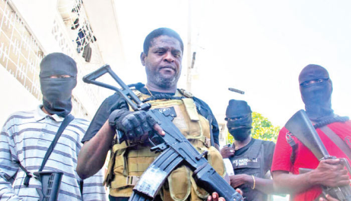 Former police officer Jimmy Barbecue Cherizier, leader of the G9 gang alliance, speaks during a press conference in Delmas 6, Port-au-Prince, Haiti March 5, 2024.—AFP