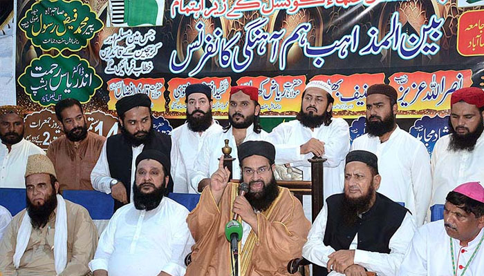 September 14 - Chairman Pakistan Ulema Council & President International Faith Harmony Council Hafiz Tahir Mehmood Ashrafi is addressing to the Interfaith Harmony Conference at Razaabad. —APP/File