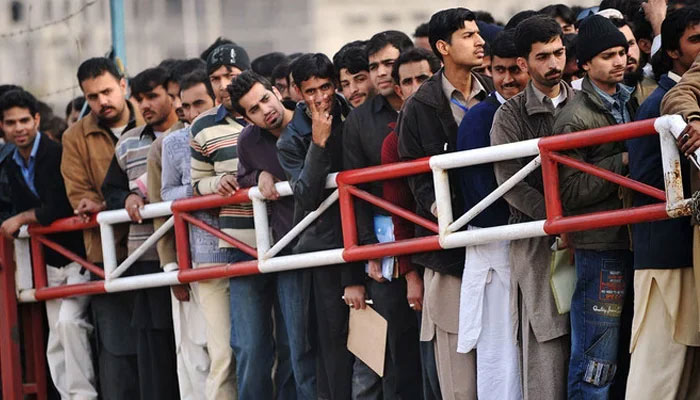 Pakistani youth wait for their turn for a Capital Development Authority (CDA) job entry test in Islamabad on January 27, 2010. — AFP/File