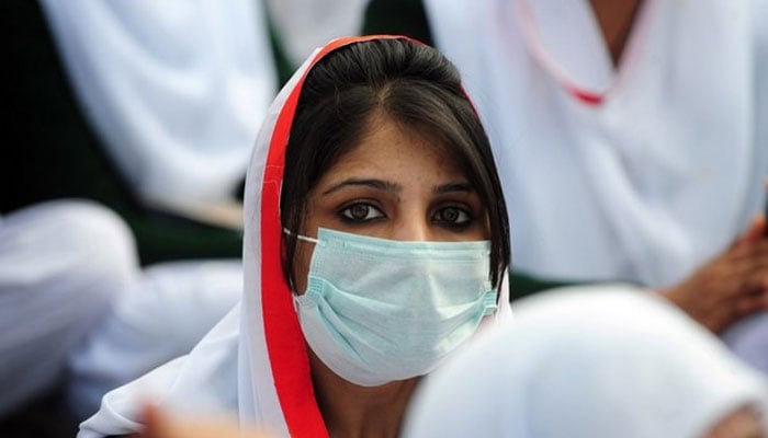 In this file photo, a Pakistani paramedic sits with others at a protest rally in Islamabad on January 31, 2012. —AFP/File