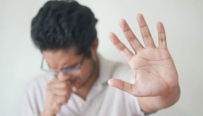 Representational image showing a person coughing. — pexels