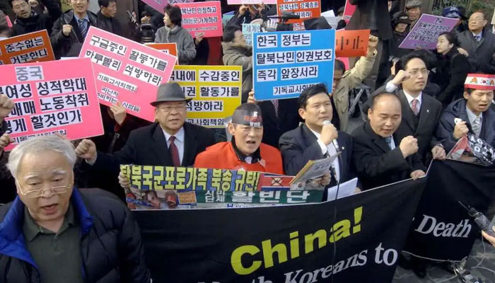 South Korean human rights activists hold a rally against deportation of North Korean defectors in front of the Chinese embassy in Seoul. — AFP/File