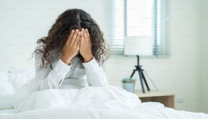 This representational picture shows a woman experiencing a headache. — Unsplash/File