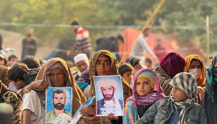 Family members of Baloch missing persons sit in protest in Islamabad. — X/@MahrangBaloch_/File