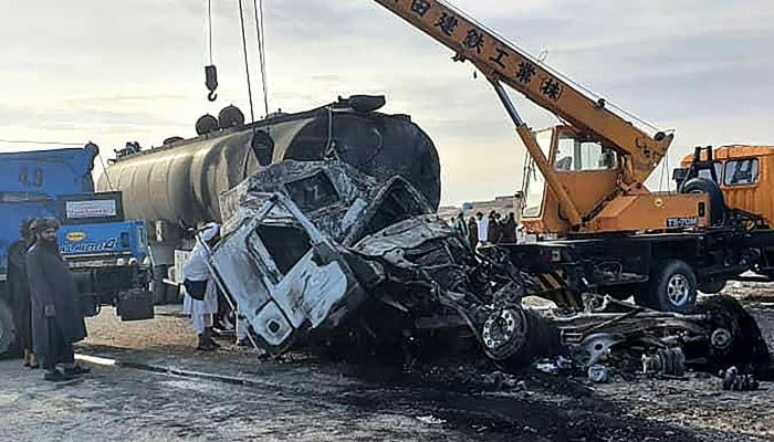 This image shows the wreckage of a passenger bus and oil tanker after the bus collided with a motorbike. — AFP/File