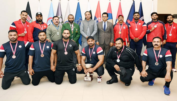 Police athletes pose for a group photo after winning medals in the 20th Men Classic National Powerlifting Championship 2024 this image was released on March 18, 2024. — Facebook/Punjab Police Pakistan