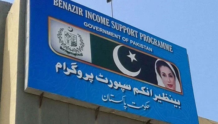 A billboard can be seen with the Benazir Income Support Programme (BISP) written on it. — APP File