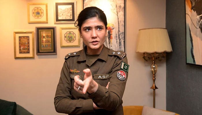 Syeda Shehrbano Naqvi, an assistant superintendent with Punjab police speaks during an interview with at her office in Lahore on February 27, 2024. — AFP
