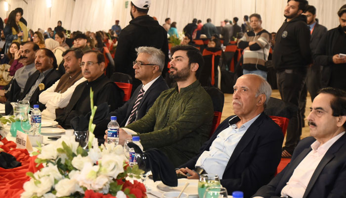 Actor Fawad Khan looks towards the stage during an Iftar dinner organised by the Shaukat Khanum Memorial Trust (SKMT) in Lahore on March 18, 2024. — Facebook/Shaukat Khanum Memorial Cancer Hospital and Research Centre