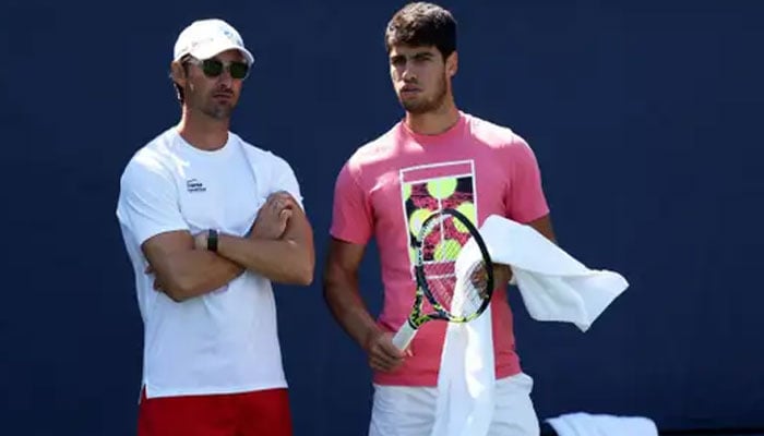 Carlos Alcaraz (left) pictured alongside his coach Juan Carlos Ferrero. — AFP/File
