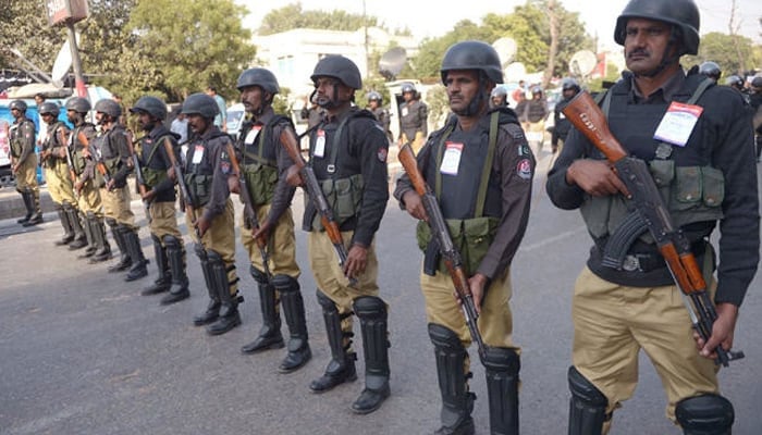 Karachi police personnel stand guard at an undisclosed location. — AFP/File