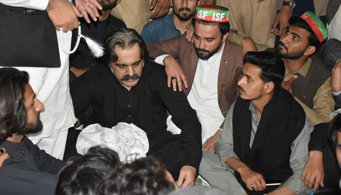 KP Chief Minister Ali Amin Gandapur (C) seen surrounded by PTI workers at his residence on March 19, 2024. — Facebook/Ali Amin Khan Gandapur