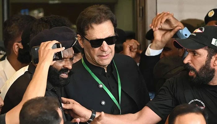 PTI Founder Imran Khan leaves after appearing in the Supreme Court in Islamabad on July 24, 2023. — AFP