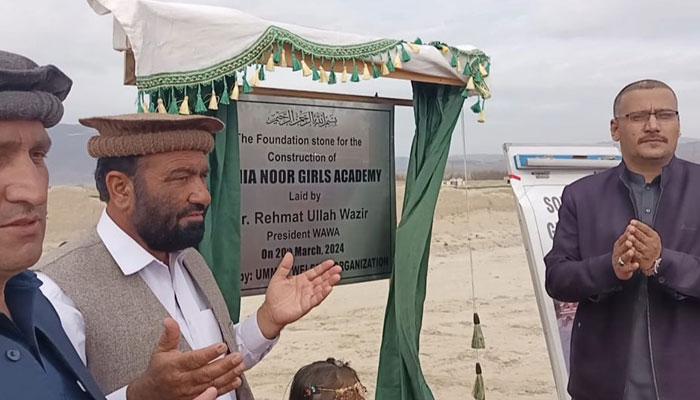 Additional Deputy Commissioner Lower South Waziristan Kashmir Khan (R) and WAWA president Rehmatullah Wazir offer Fateha during the foundation stone laying ceremony for Sophia Noor Girls Academy Wana on March 20, 2024. — Facebook/WAWA- Wana Welfare Association Official