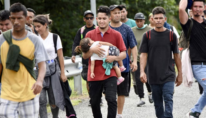 Venezuelan migrants walk to Tapachula from Huixtla, Chiapas state, Mexico, on Oct. 14, 2022.—AFP