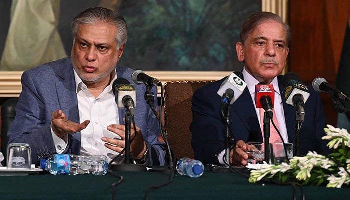 Prime Minister Shehbaz Sharif (right) and Foreign Minister Ishaq Dar address a press conference in Lahore.  — AFP/File