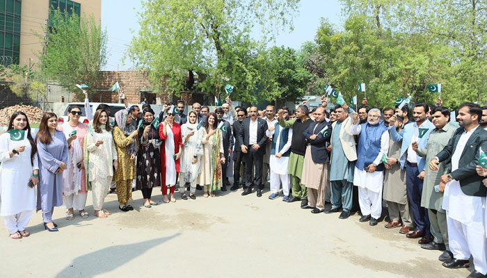 People poses for a group photo during the occasion of the 23rd March ceremony on March 23, 2024. — Facebook/Central Business District Punjab