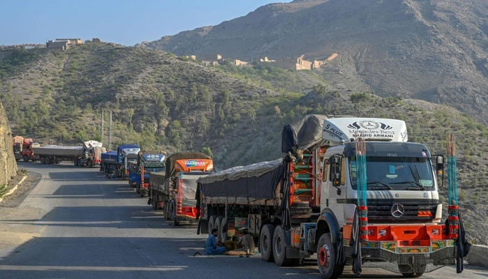Trucks are seen parked along a road near the Pakistan-Afghanistan border. — AFP/File