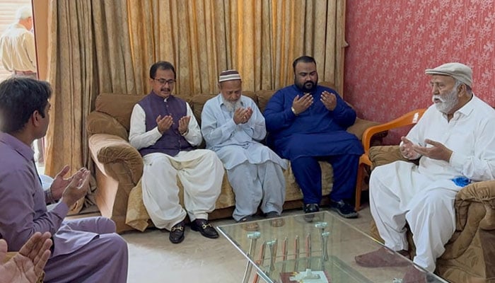 Sindh Pakistan Tehreek-e-Insaf (PTI) president Haleem Adil Sheikh offers condolences to the family of Lieutenant Colonel Syed Kashif Ali on March 22, 2024. — Facebook/Haleem Adil Sheikh