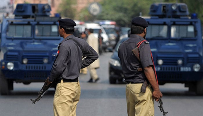Sindh police personnel stand at an undisclosed location. — AFP/File