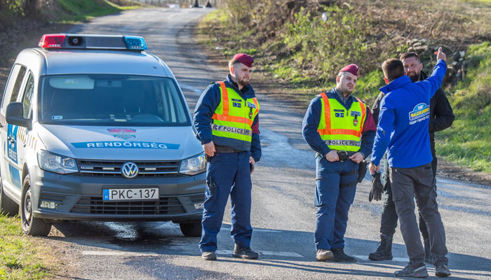 Police officers closed roads near the rally crash site in northern Hungary  on March 24, 2024. — AFP