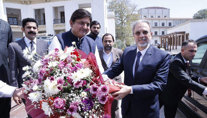 In this image, Punjab Assembly Speaker Malik Muhammad Ahmad Khan presents a flower bouquet to the Ambassador of Turkiye Dr Mehmet Paçac on March 25, 2024. — Facebook/Malik Muhammad Ahmad Khan