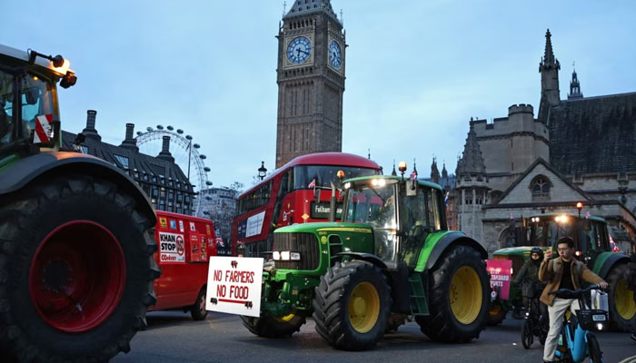 Farmers drive tractors around Parliament Square during a demonstration organized by Save British Farming against UK food policy, substandard imports, and food labeling regulations, in London on March 25, 2024. — AFP/File