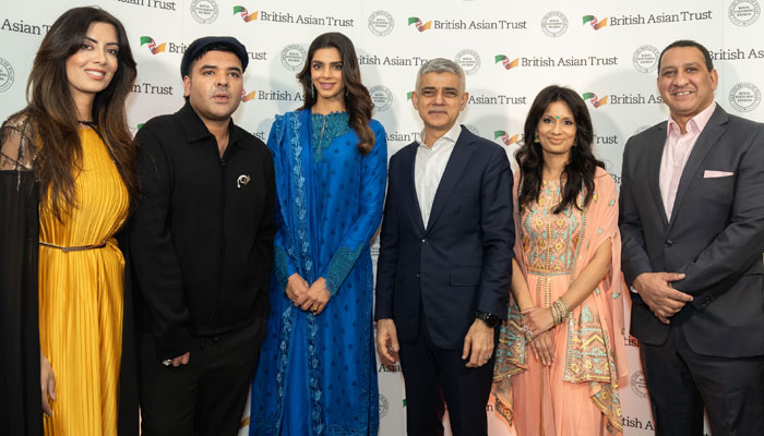 Pakistani actor Sanam Saeed (third left), London Mayor Sadiq Khan (fourth left) pictured alongside other attendees at the event. — Reporter