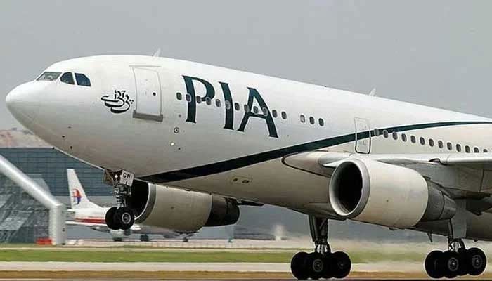 A PIA aeroplane can be seen on the runway. — AFP/File