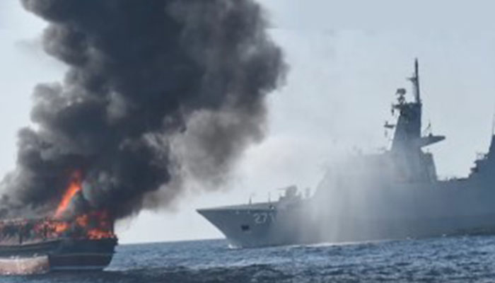 Pakistan Navy vessel PNS Yarmouk pictured alongside the burning Iranian fishing boat. — Screengrab/X/@dgprPaknavy/File