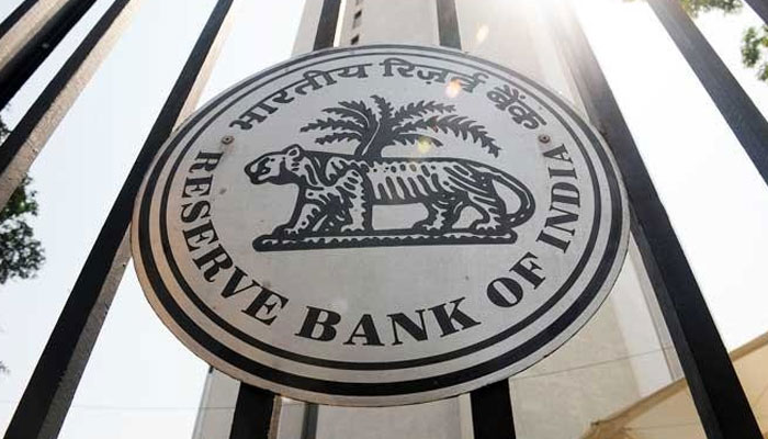 The Reserve Bank of India (RBI) logo can be seen on the main entrance gate of the RBI headquarters in Mumbai. — AFP/File