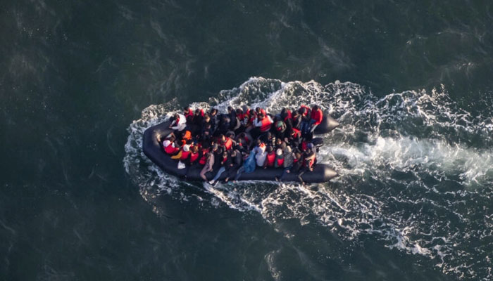 Migrants on a boat traveling from northern France to the UK. — AFP/File