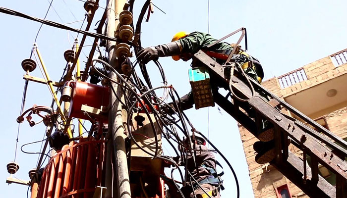 Line workers carrying out maintenance activity on a transformer. — KE wesbsite/File