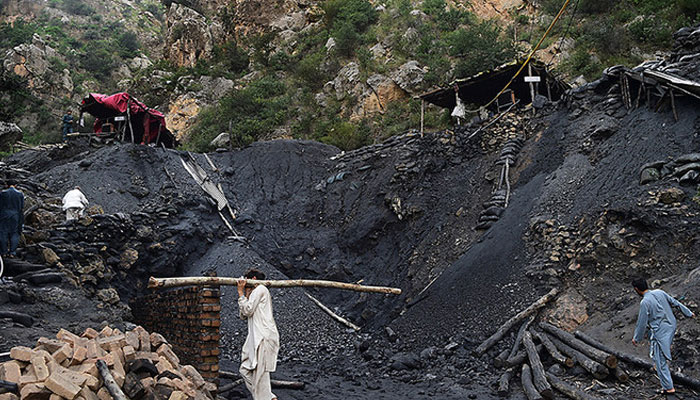 Pakistani miners fix a collapsed coal mine in Akhurwal village, in Darra Adam Khel town. — AFP/File