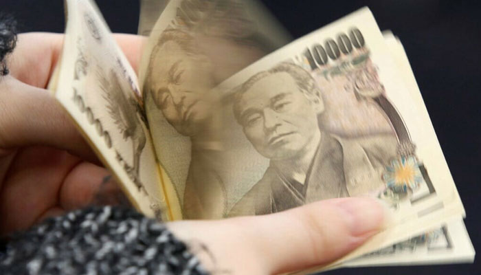 Japan steps up intervention warnings as yen slides to weakest level since 1990