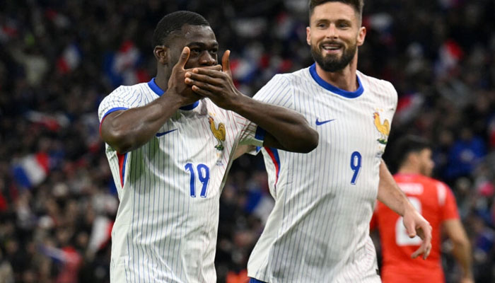 French footballers Youssouf Fofana (L) and Olivier Giroud can be seen in this image. — AFP/File