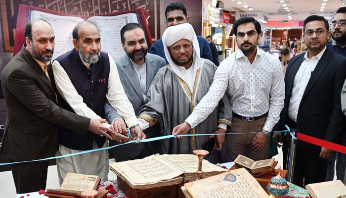 Chairman of the (CII) Dr Qibla Ayaz along with others cut the ribbon at the opening ceremony of the Quran Exhibition of Manuscripts on March 27, 2024. —  APP