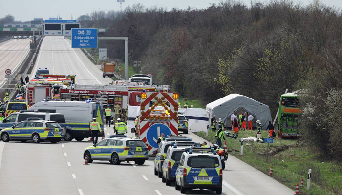 This image shows the multiple police vehicles and medical staff after the accident on the major road in eastern Germany A9 highway. — AFP/File