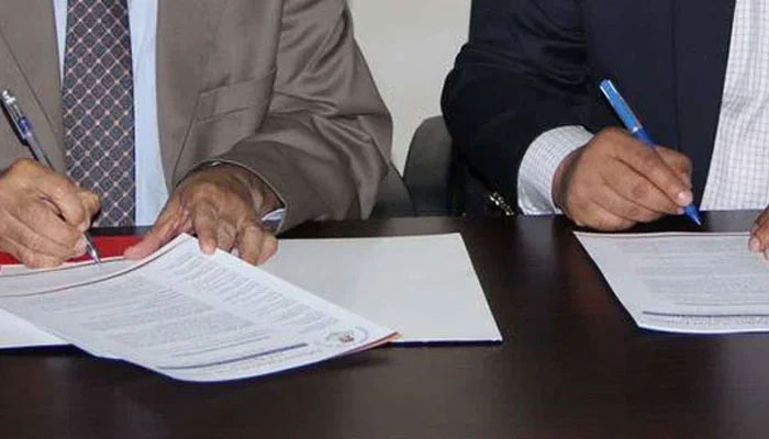 This representational image shows officials signing an agreement during the MOU signing ceremony. — APPNA Website/File