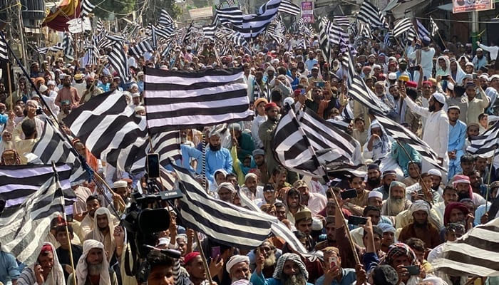 JUIF party supporters hold flags during a party rally in this image released on October 26, 2203. — Facebook/Jamiat Ulama-e-Islam Pakistan