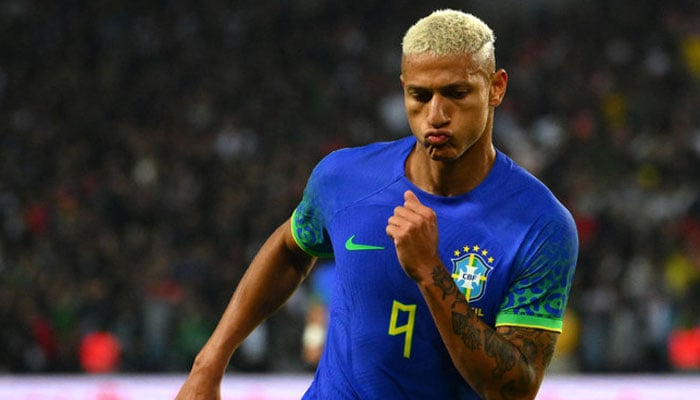Brazils forward Richarlison after scoring his teams second goal during the friendly football match against Tunisia at the Parc des Princes in Paris on Sept> 27, 2022. — AFP